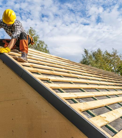 Professional Construction Worker Assembling Roof Wooden Elements